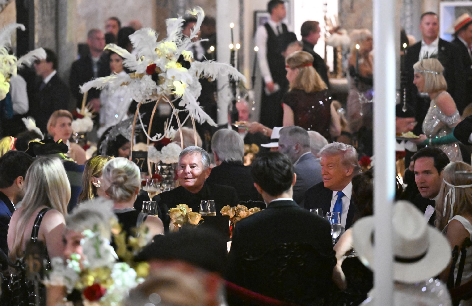 Trump was pictured enjoying himself at the Halloween bash at his Palm Beach residence, surrounded by guests in Roaring 20s-style getup