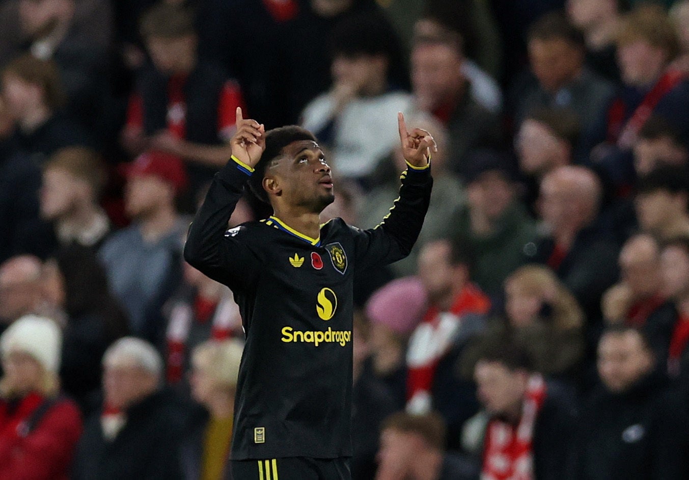 <p>Amad Diallo celebrates after scoring Manchester United's second goal</p>