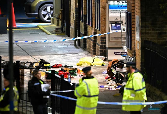 <p>Paramedics medical equipment is pictured in side a police cordon outside Huntingdon Station</p>