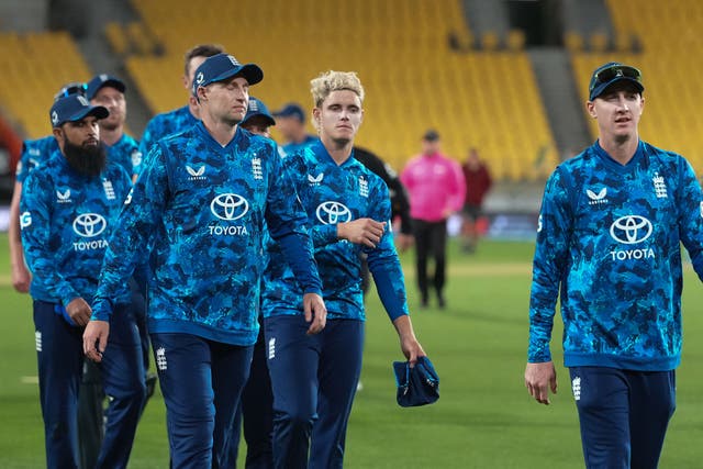 <p>England players walk from the field after their loss in the third one-day international</p>
