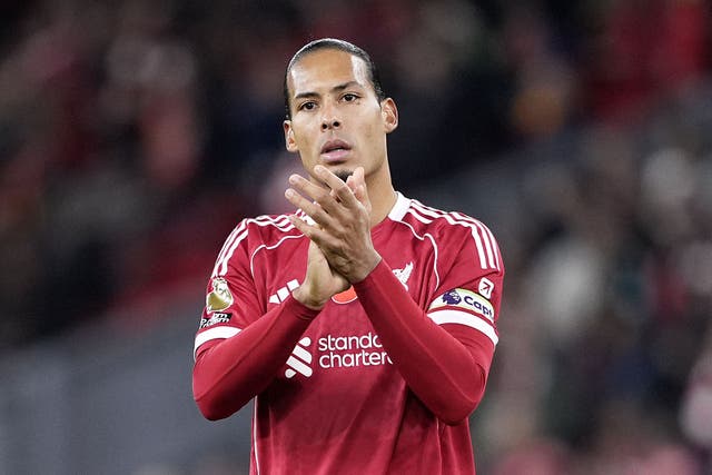 Liverpool captain Virgil van Dijk applauds fans after the 2-0 win over Aston Villa at Anfield (Peter Byrne/PA).