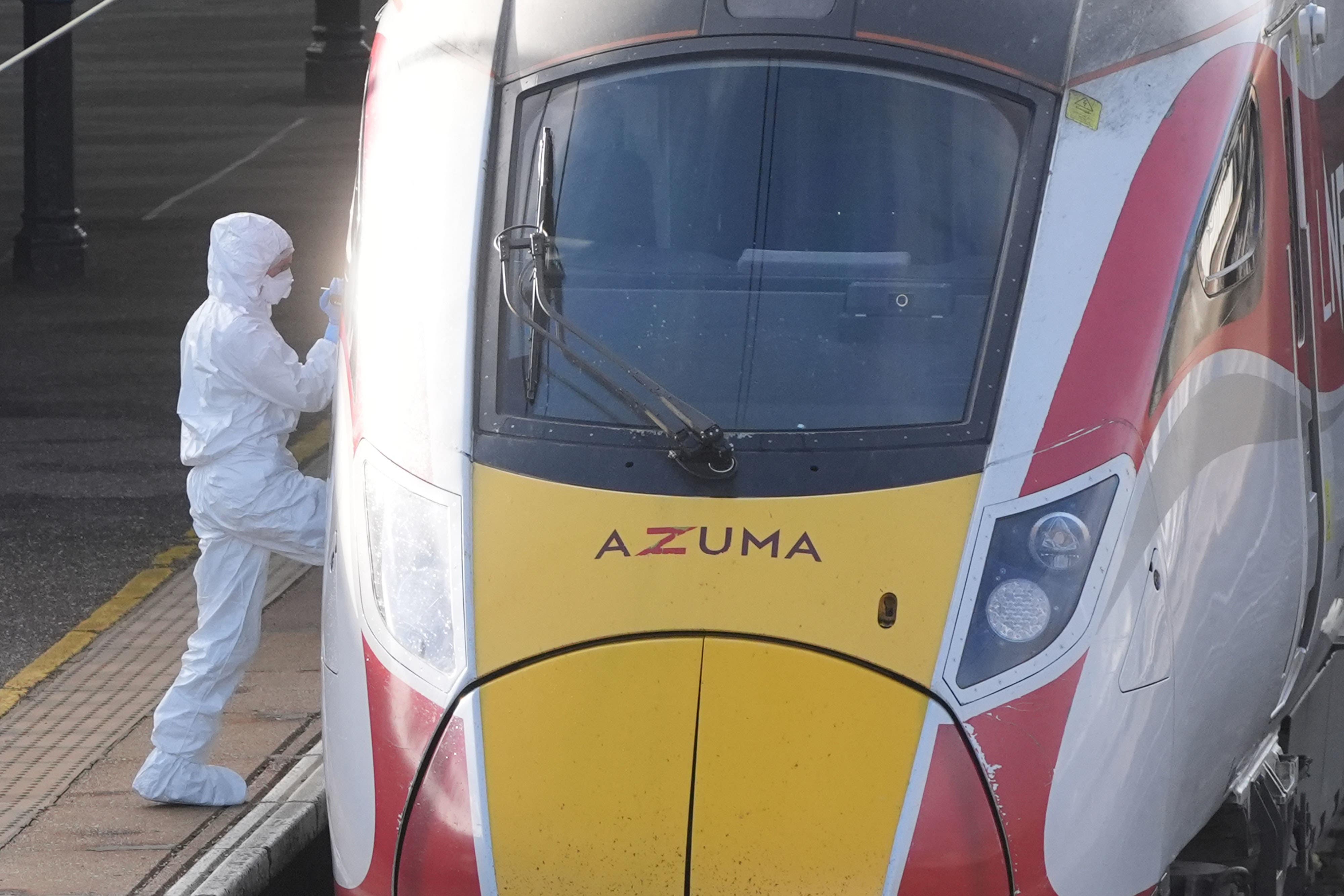 A forensic investigator boards the train at Huntingdon train station in Cambridgeshire, after a number of people were stabbed on the train on Saturday. Two people have been arrested after British Transport Police were called to the incident. Picture date: Sunday November 2, 2025.