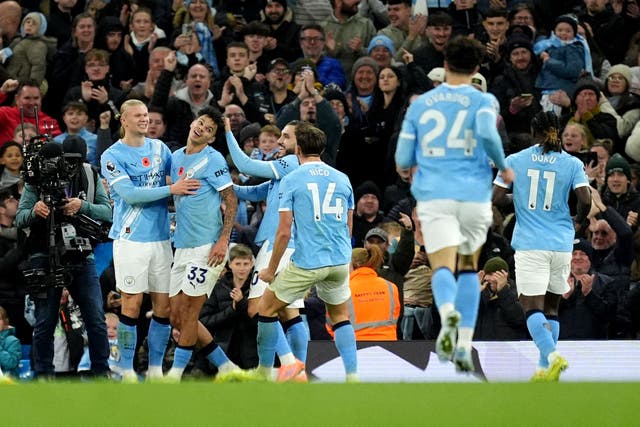 Nico O’Reilly (second left) celebrates his goal in Manchester City’s 3-1 win over Bournemouth (Martin Rickett/PA)