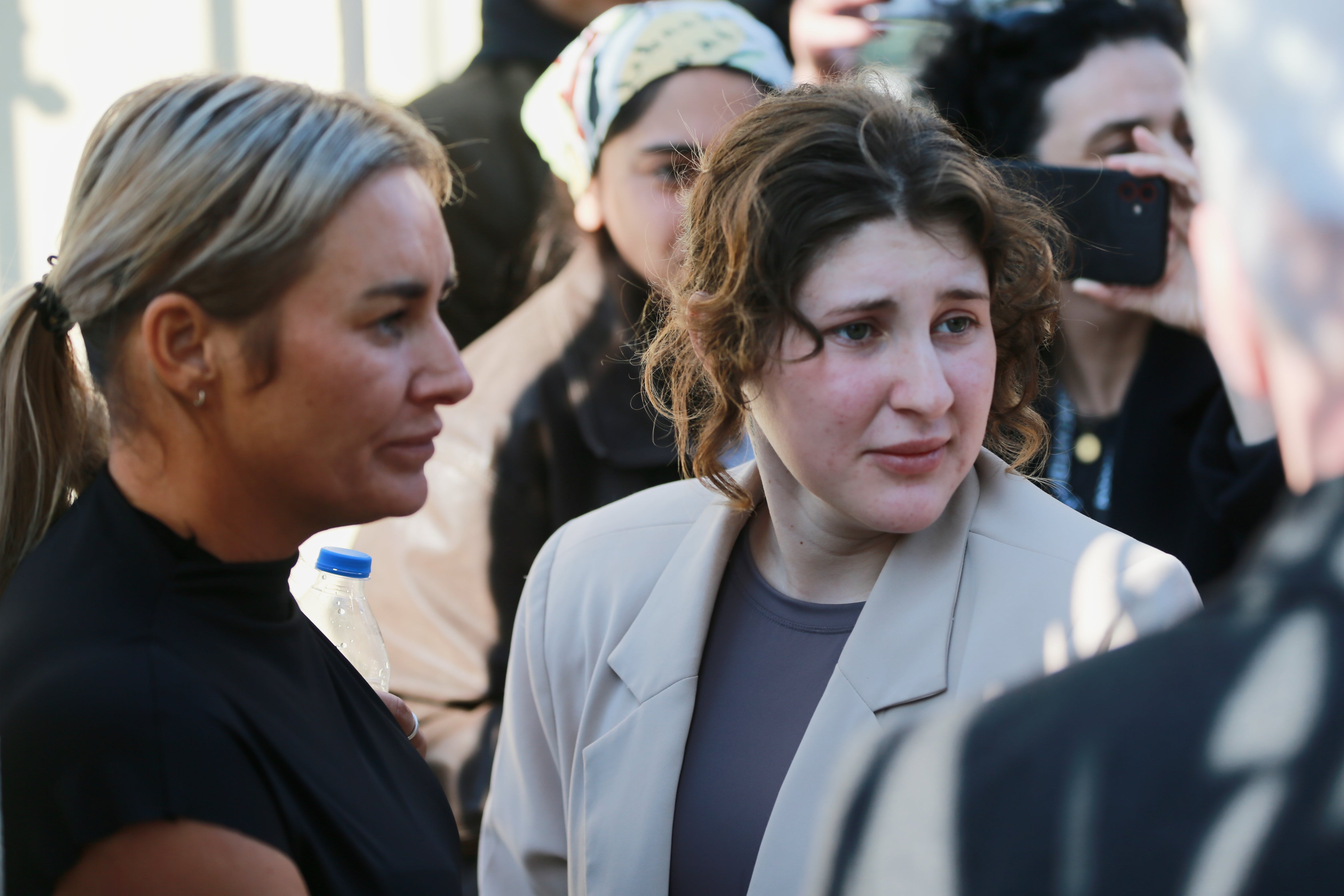 Bella May Culley, the 19-year-old, speaks to journalists after she was released from prison near the court building in Tbilisi, Georgia; her mother Lyanne Kennedy, stands on the left.