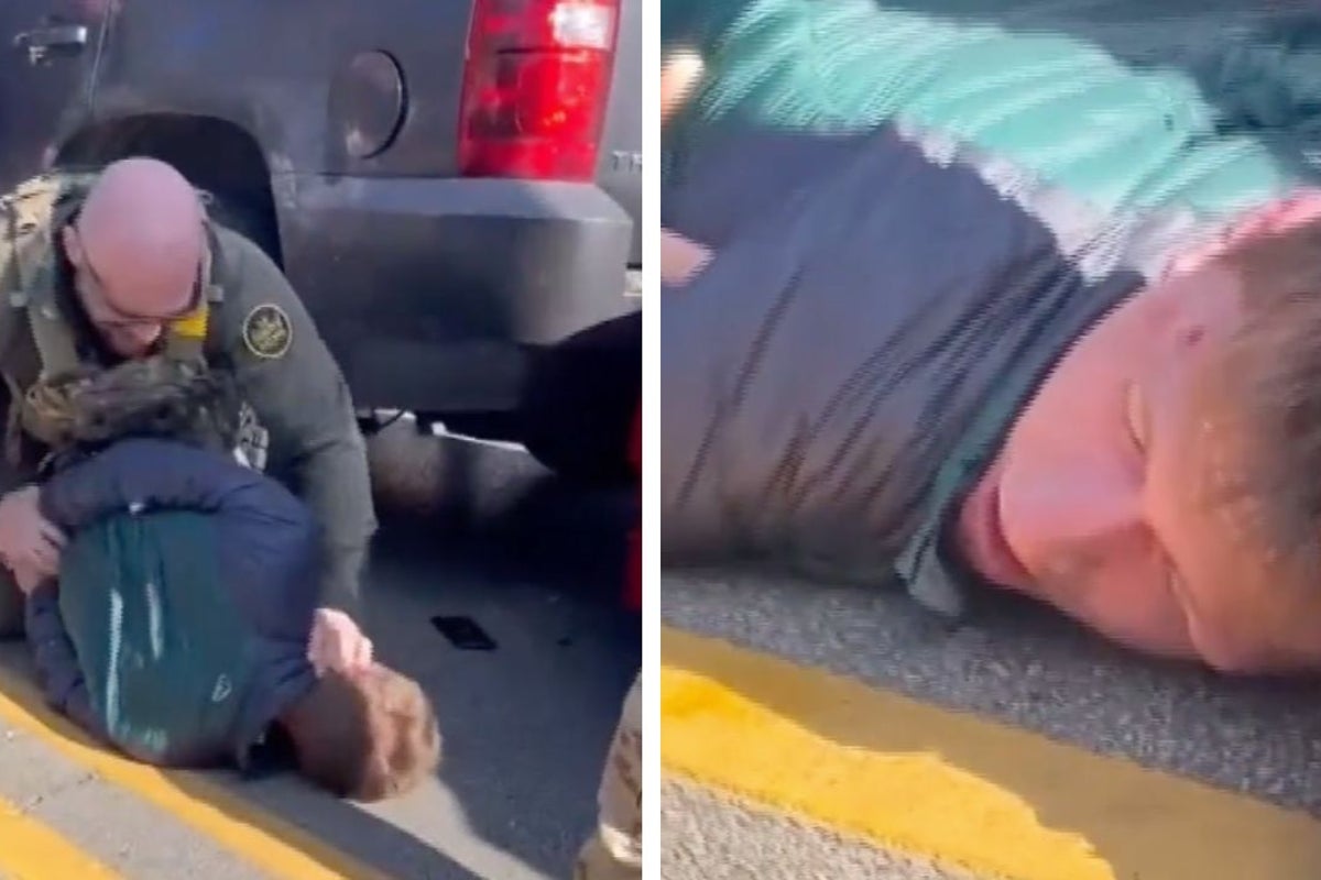 Immigration agent filmed punching restrained man on ground following Chicago car collision