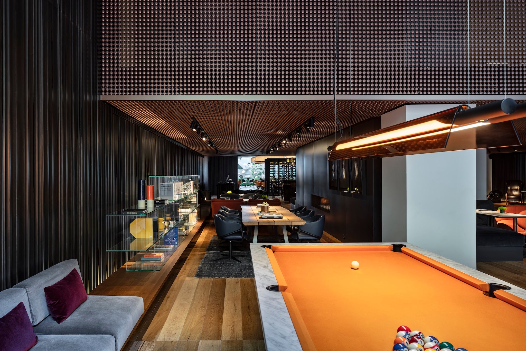 <p>Game on: an orange felt billiard table is the focal point of the hotel’s chic and simple lobby</p>