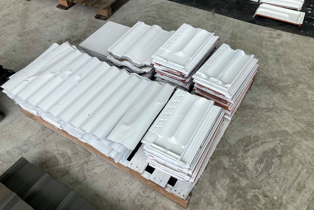 <p>Roof tiles and steel panels coated in the new paint</p>