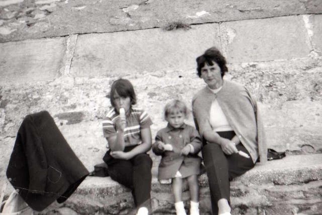 <p>Michelle Taylor, centre, with her mother Sylvia Bennett, right, and her older sister </p>