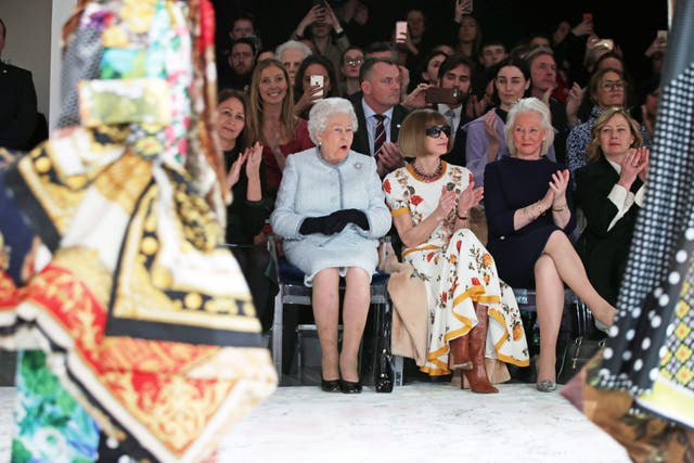<p>Queen Elizabeth II reacts as she sits with Anna Wintour at Richard Quinn’s runway show </p>