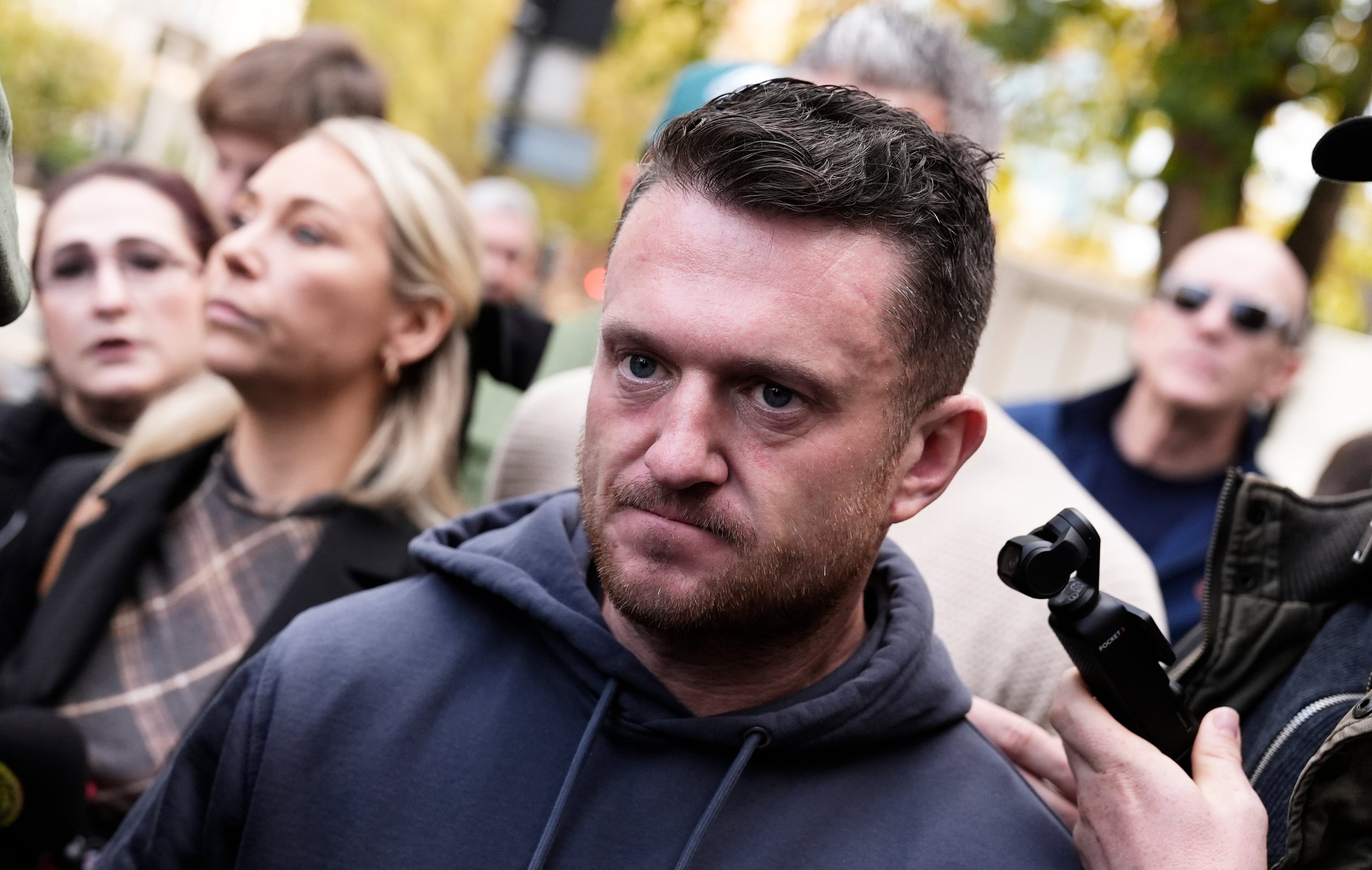 <p>Tommy Robinson (centre), whose real name is Stephen Yaxley-Lennon, outside court</p>