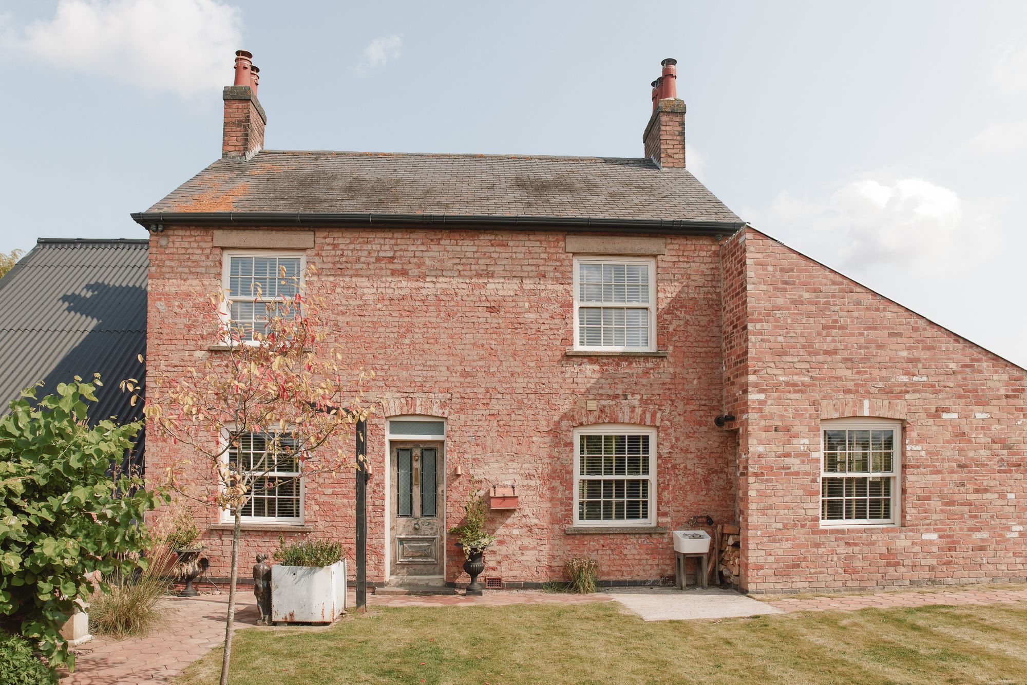 This gorgeous farmhouse comes with a wood-fired hot tub and a Swedish-style sauna