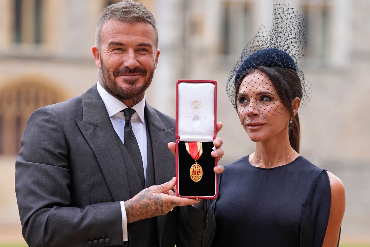Bend a knee like Beckham: Soccer star is knighted by King Charles III