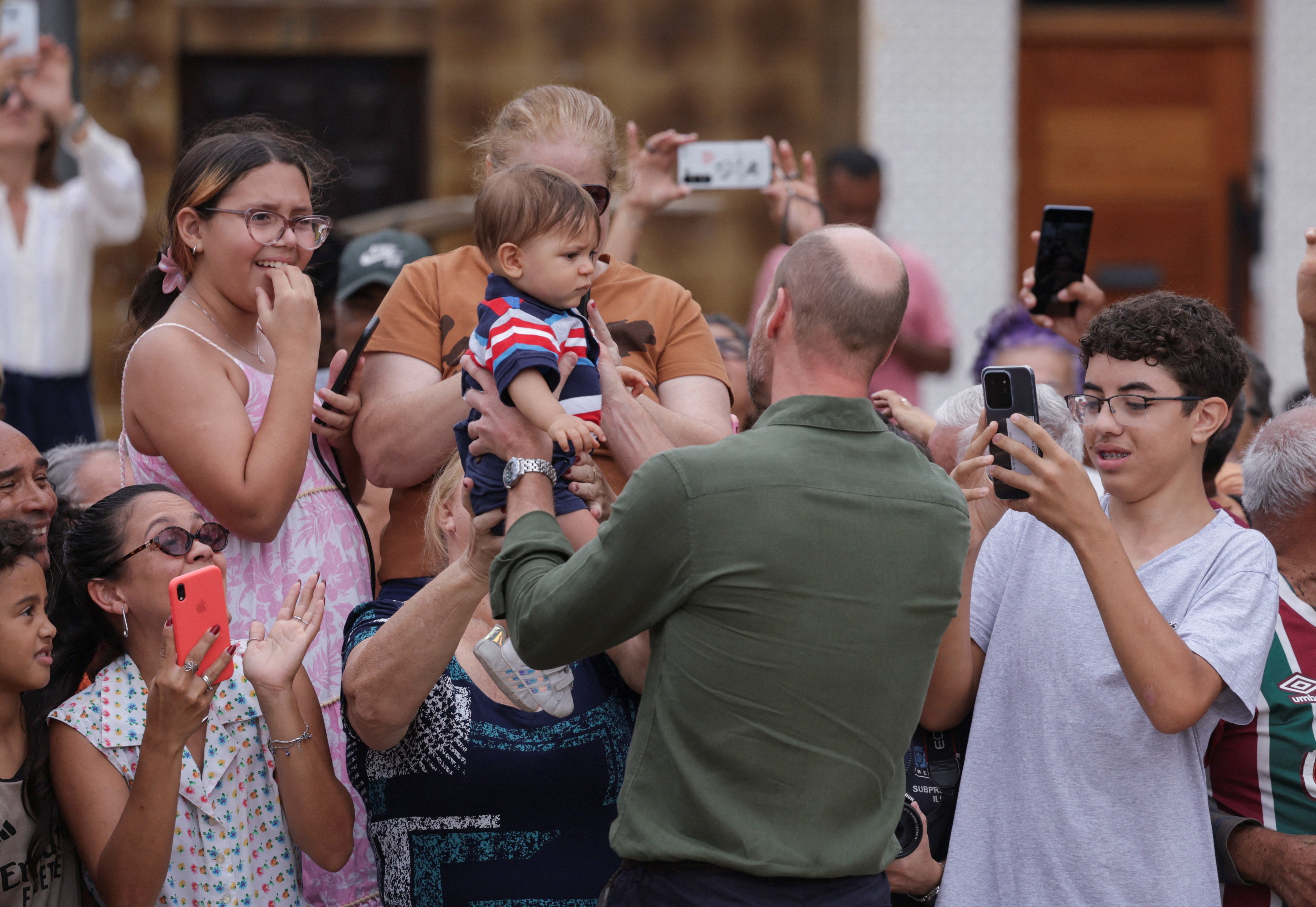 <p>Prince William greets people on Paqueta Island, during an official visit in Rio de Janeiro, Brazil</p>