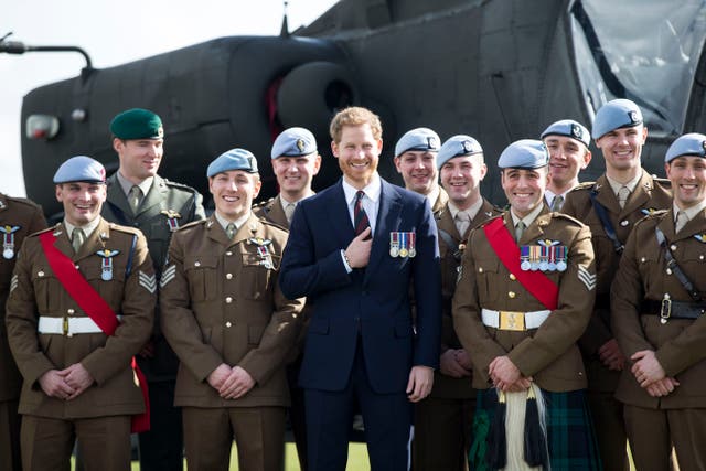 <p>Harry in front of an Apache Helicopter in 2018 (Heathcliff O’Malley/Daily Telegraph/PA)</p>