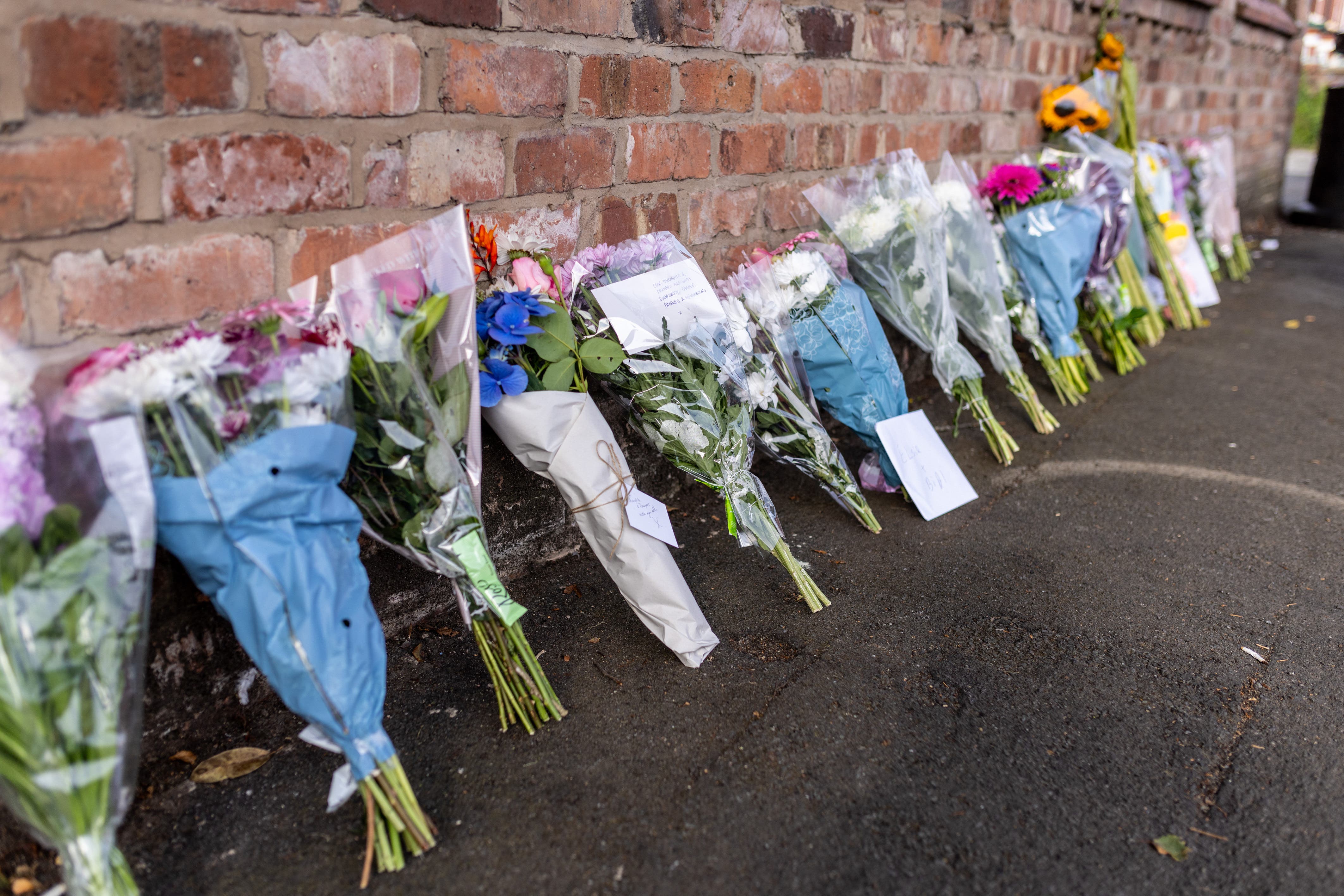 Floral tributes near the scene in Hart Street, Southport, where the attack took place (PA)
