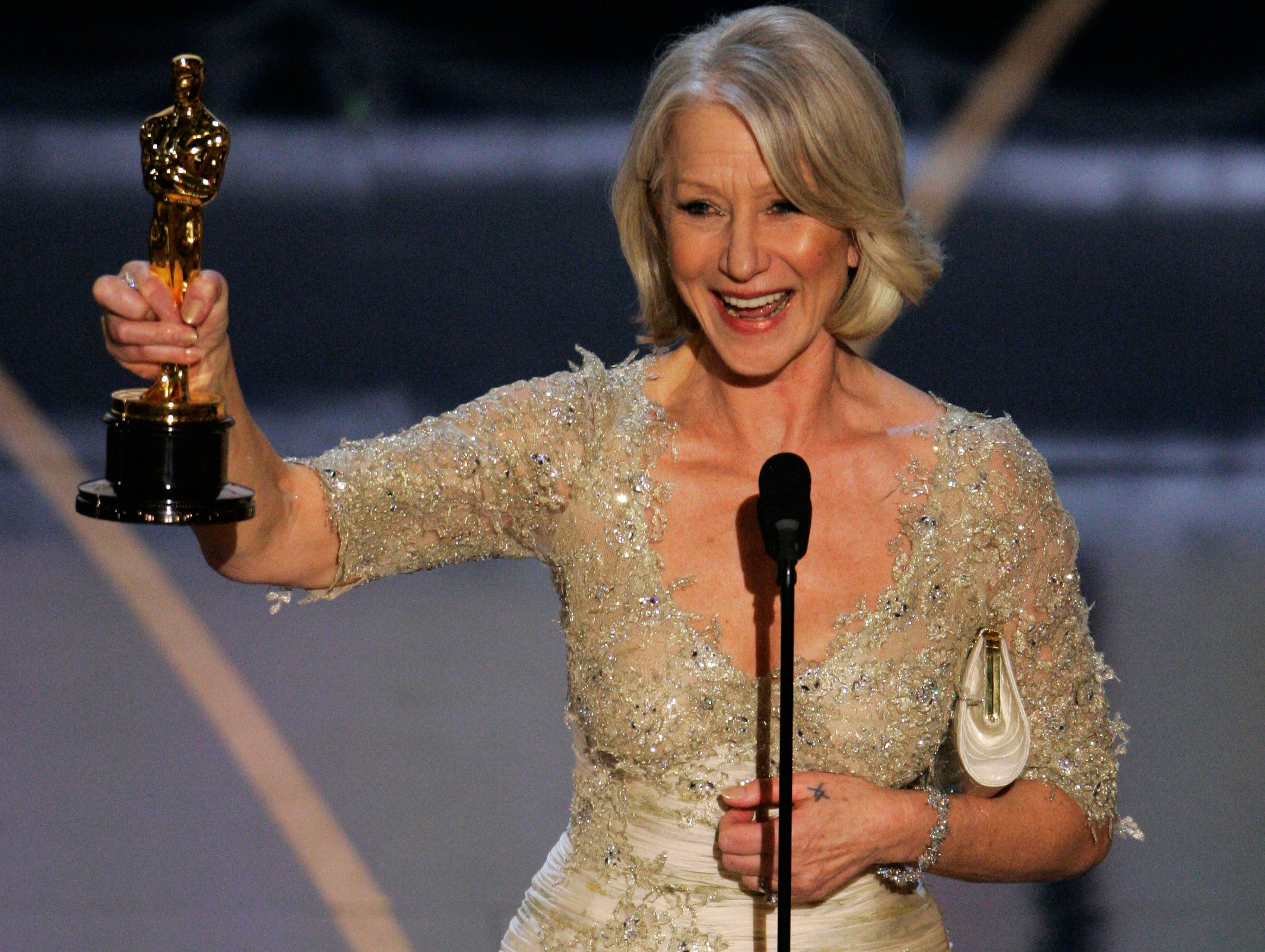 Mirren accepts the Oscar for best actress for her work in ‘The Queen’ at the 79th Academy Awards