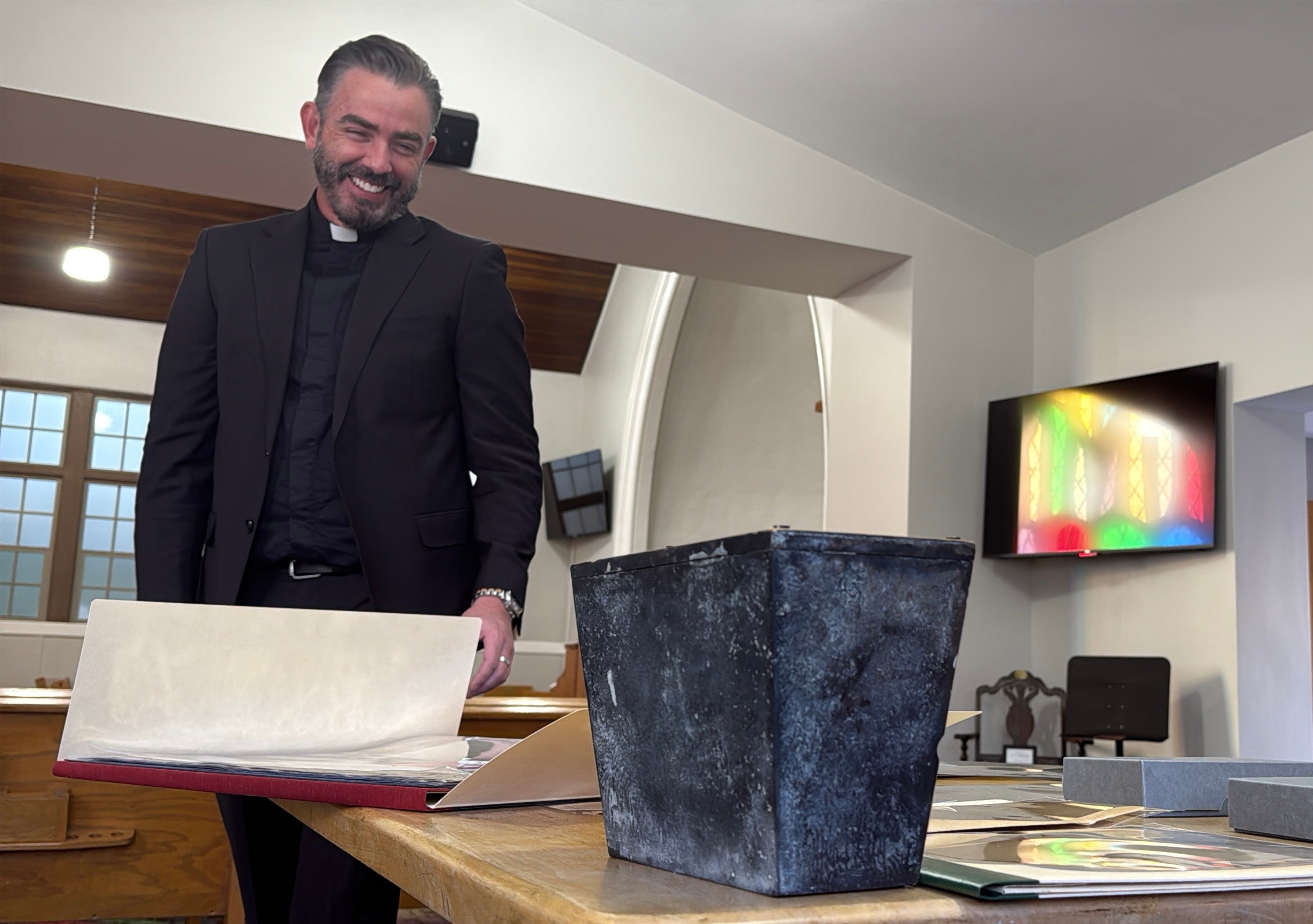 Rev. Andrew Fleishman looks at a century-old time capsule at the Japanese Church of Christ in Salt Lake City