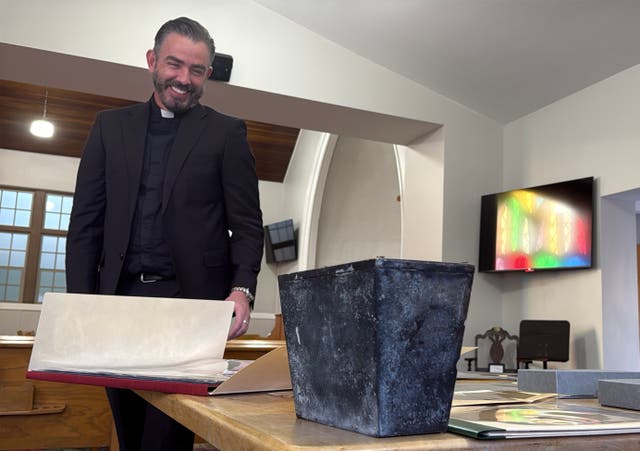 <p>Rev. Andrew Fleishman looks at a century-old time capsule at the Japanese Church of Christ in Salt Lake City</p>