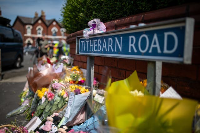 Flowers and tributes near the scene in Hart Street, Southport, where the attack happened in July 2024 (James Speakman/PA)