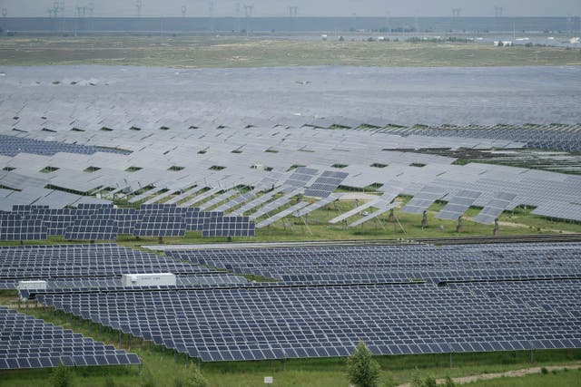 <p>FILE - A solar farm is visible in Hainan prefecture of western China's Qinghai province 1 July 2025</p>