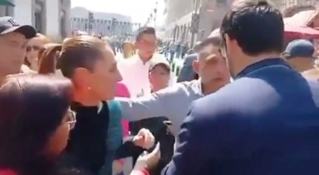 <p>Ms Sheinbaum's security swiftly stepped in during the incident</p>