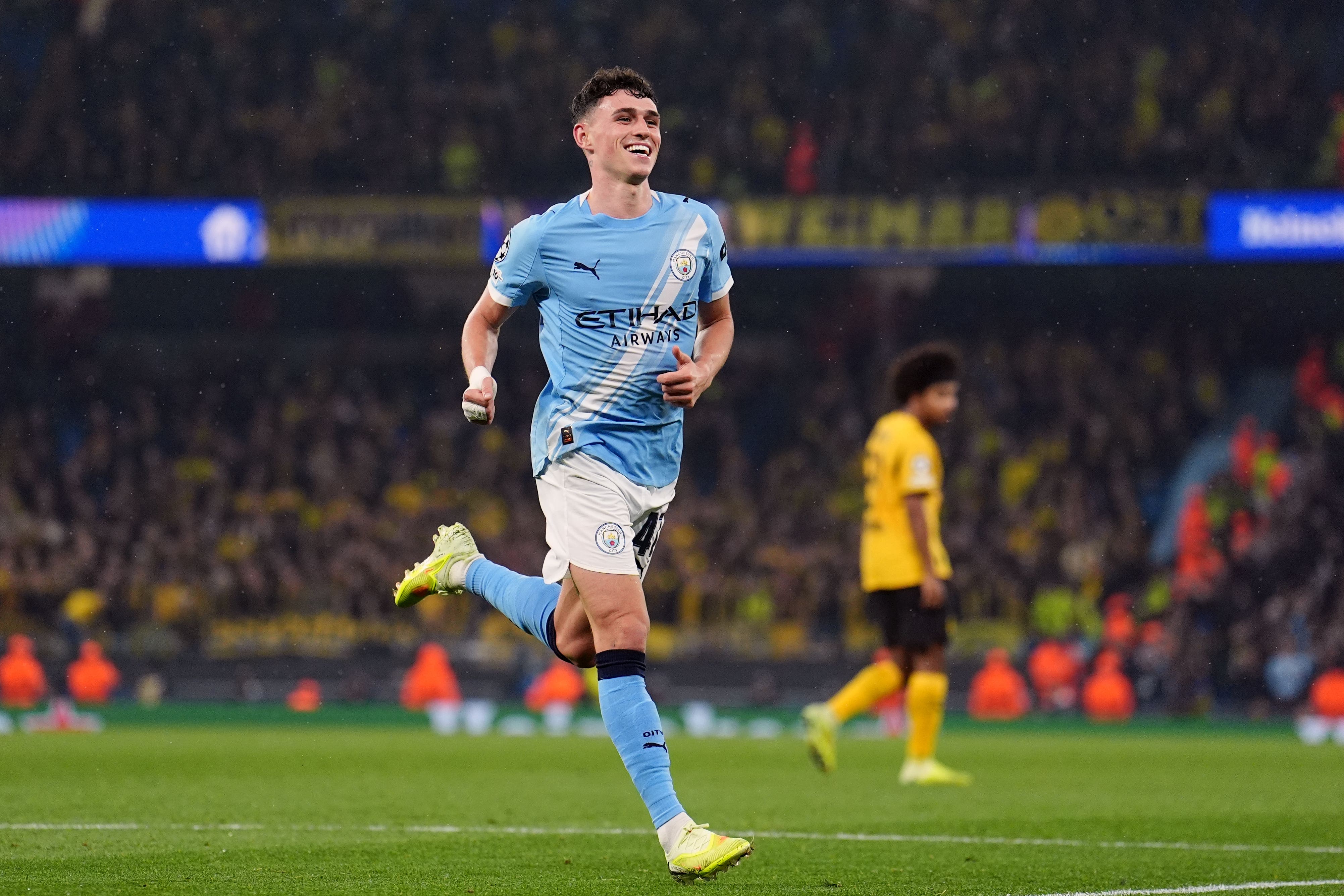Phil Foden scored twice as Manchester City beat Borussia Dortmund 4-1 (Martin Rickett/PA)