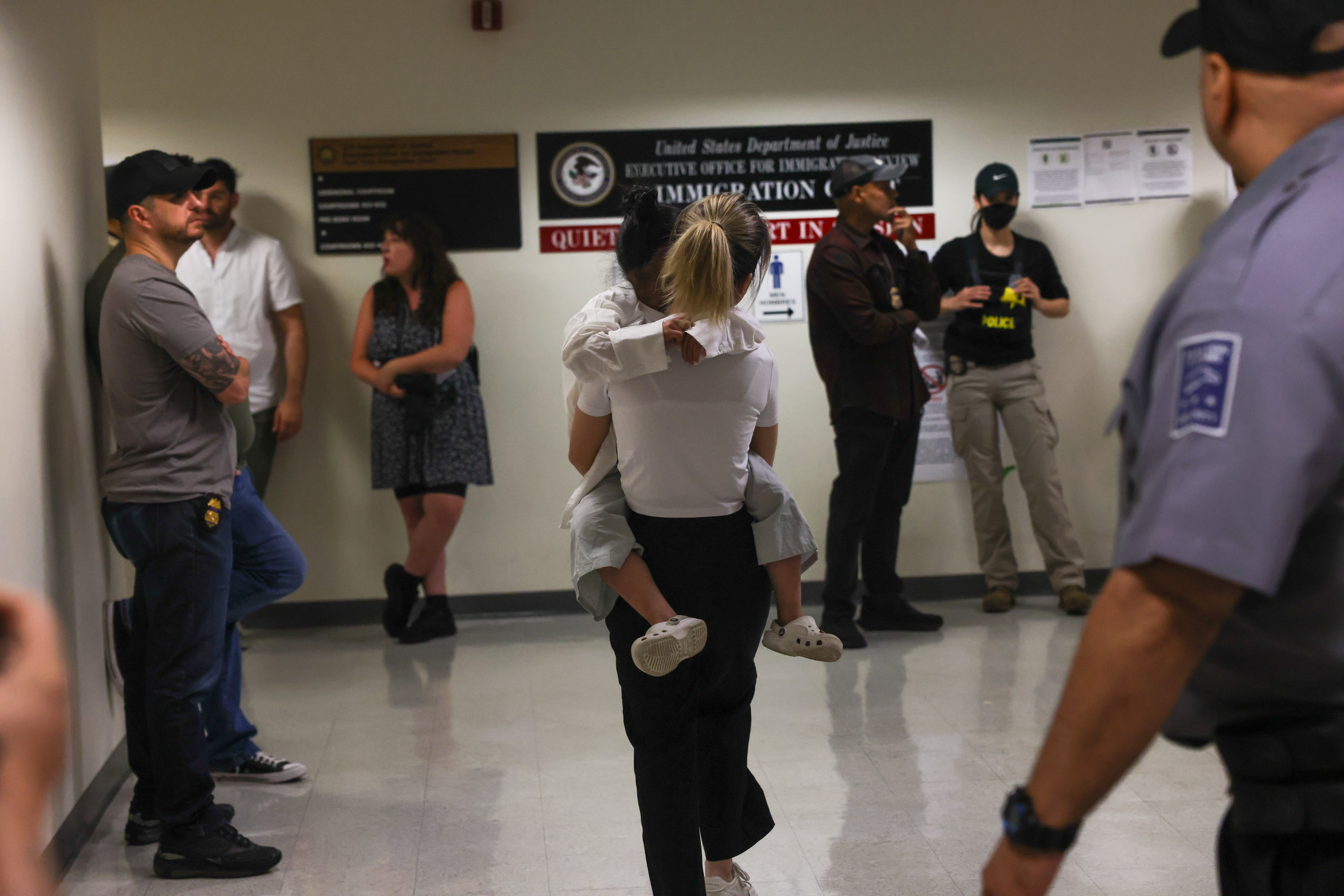 A mother hugs her child at a detention court in New York City. The Trump administration has made it more difficult to track children who are separated from their parents who have been placed in ICE custody.