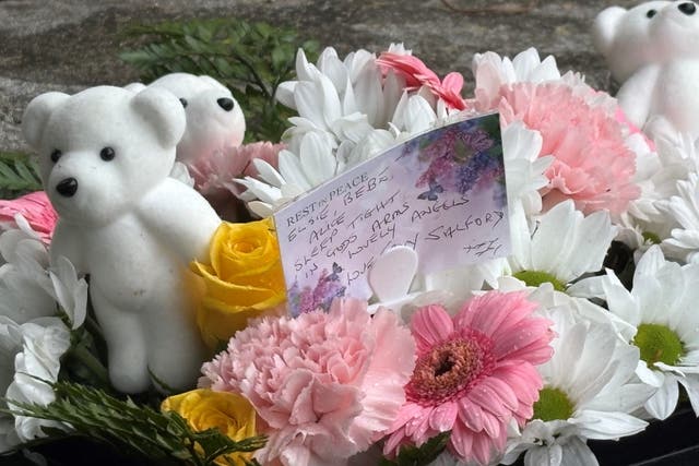 Tributes left to Alice da Silva Aguiar, nine, Bebe King, six, and Elsie Dot Stancombe, seven (Eleanor Barlow/PA)