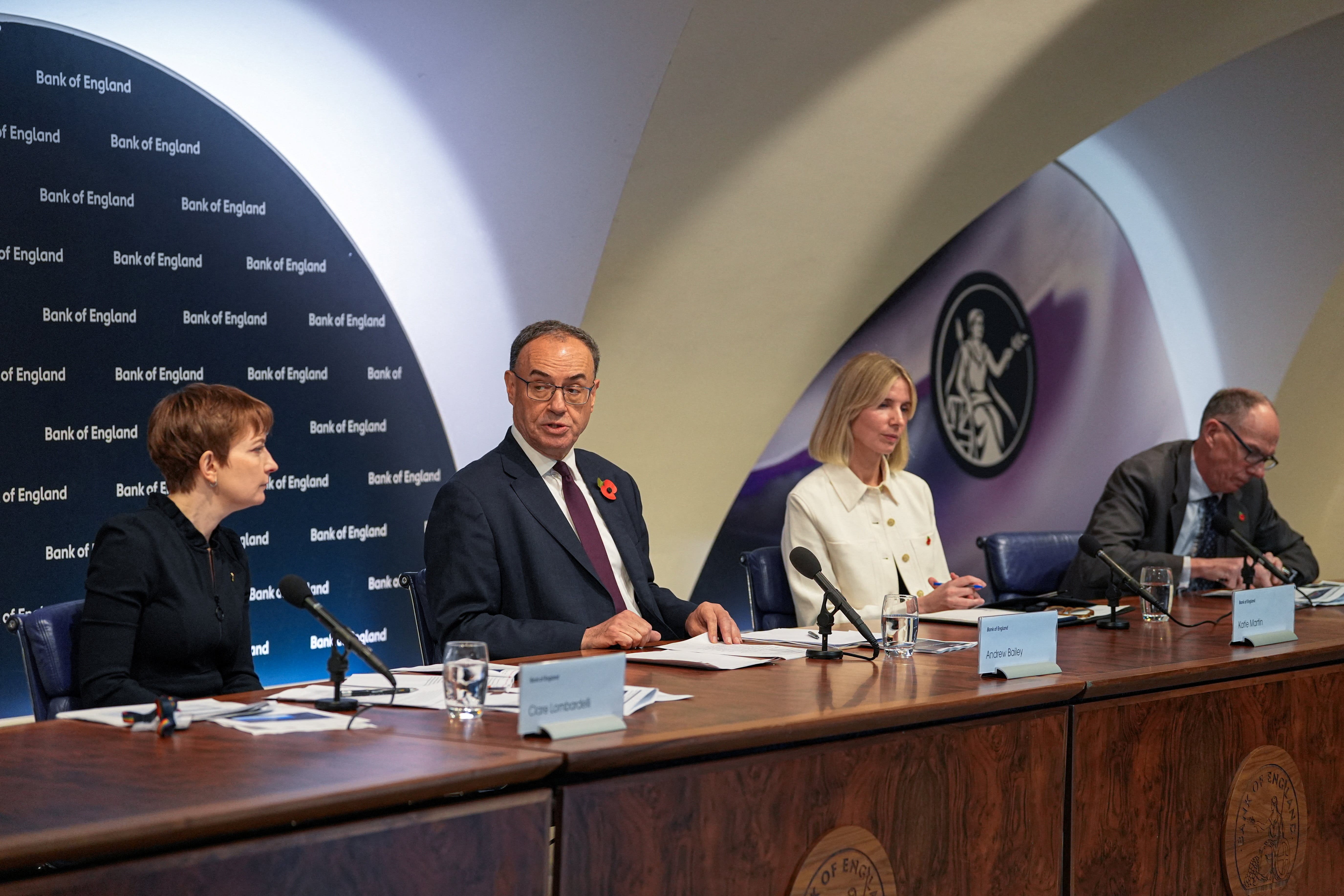 Bank of England governor Andrew Bailey, centre, during a press event after the rates were held at 4% (Maja Smiejkowska/PA)