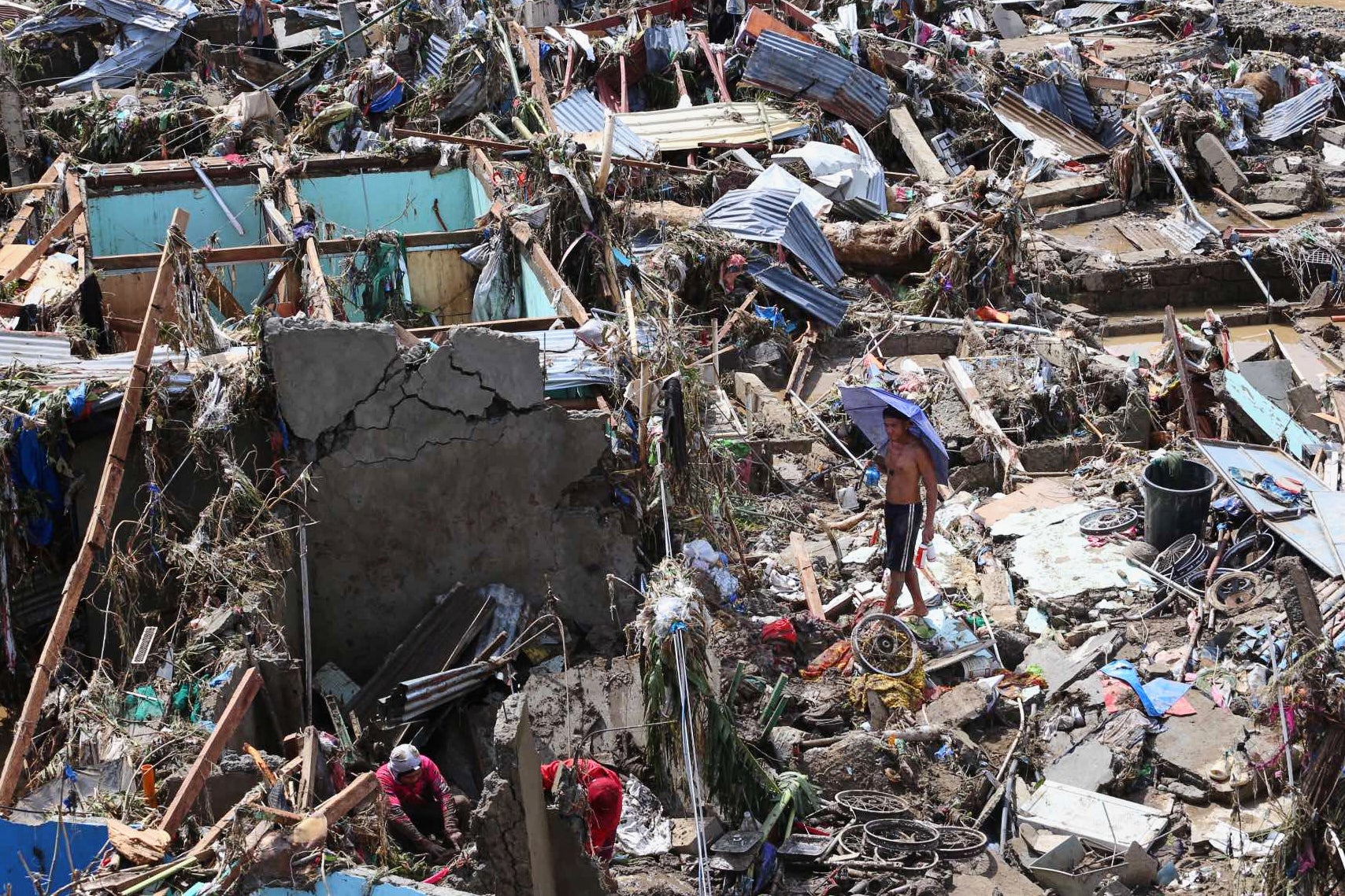 <p>Residents return to their damaged homes after Typhoon Kalmaegi caused devastation in the Philippines</p>