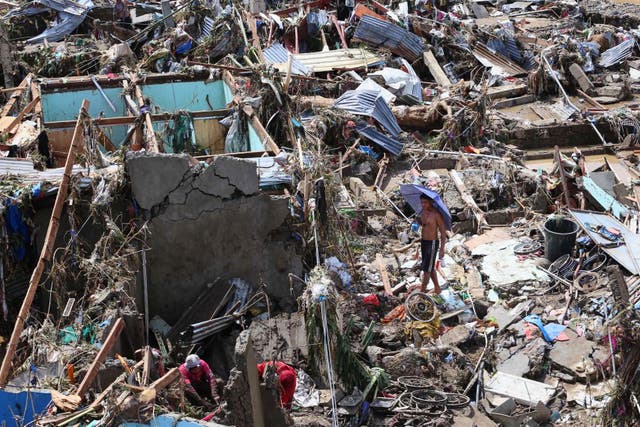 <p>Residents return to their damaged homes after Typhoon Kalmaegi caused devastation in the Philippines</p>