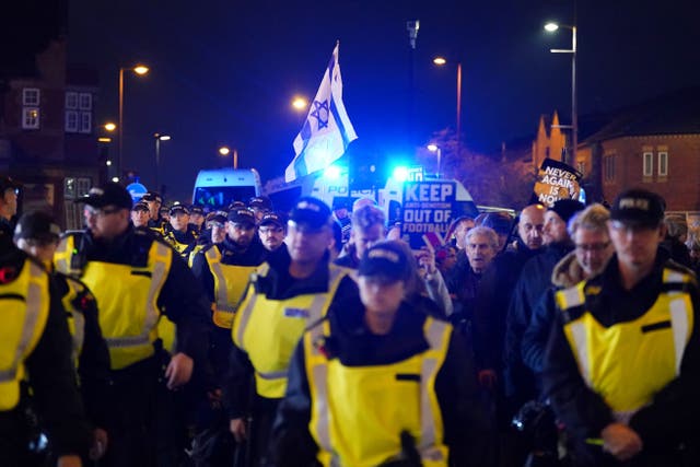 <p>Pro Israel supporters are led away from Villa Park (Jacob King/PA)</p>