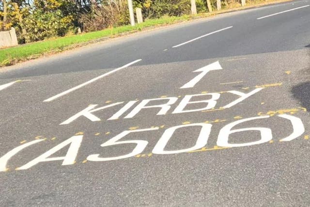 <p>The 'KIRBY' road marking at the M58 roundabout to Kirkby</p>