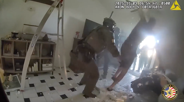 <p>Barricaded suspect falls through ceiling into the arms of SWAT team</p>