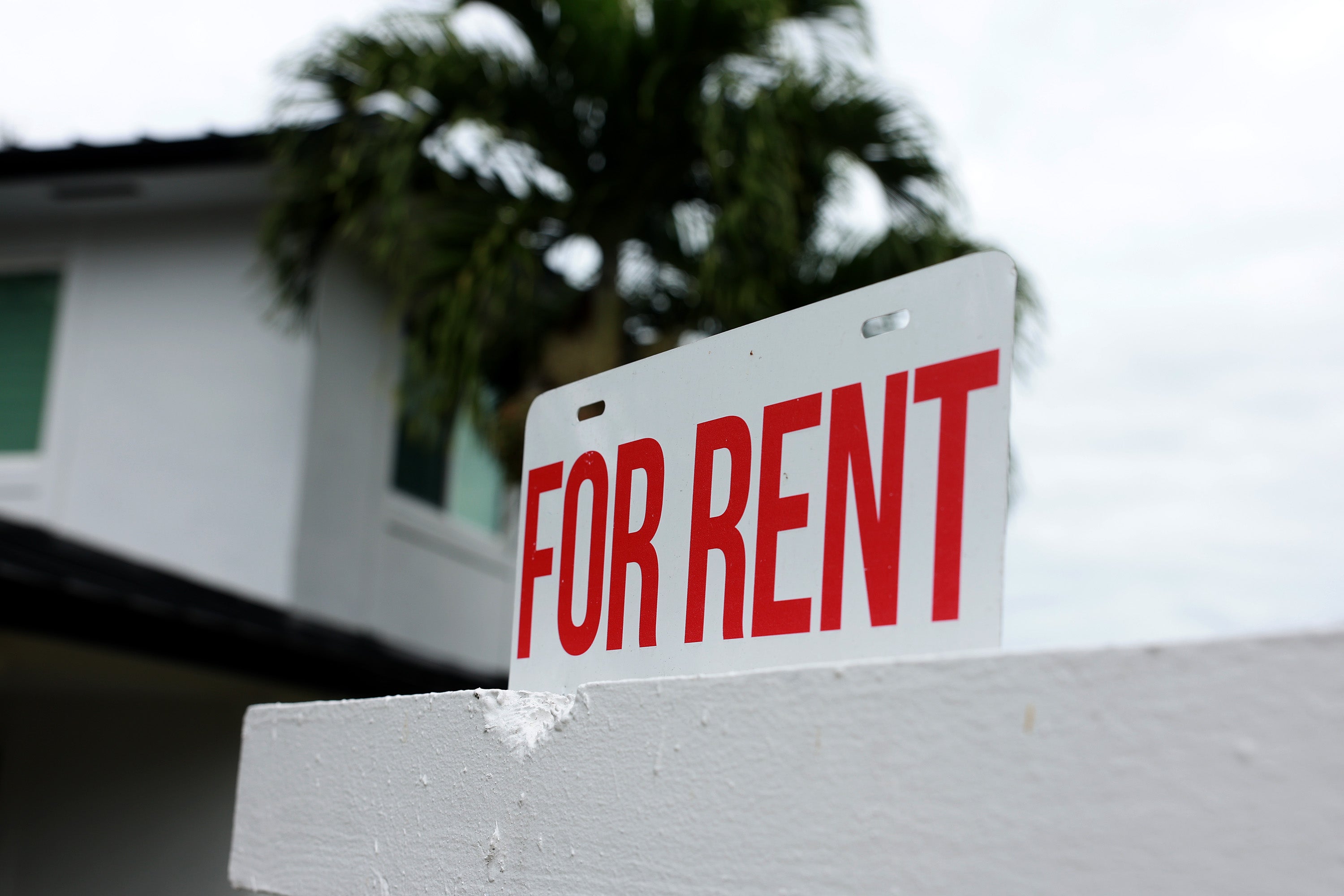 <p>A "for rent" sign is posted in front of a home on December 12, 2023 in Miami, Florida</p>
