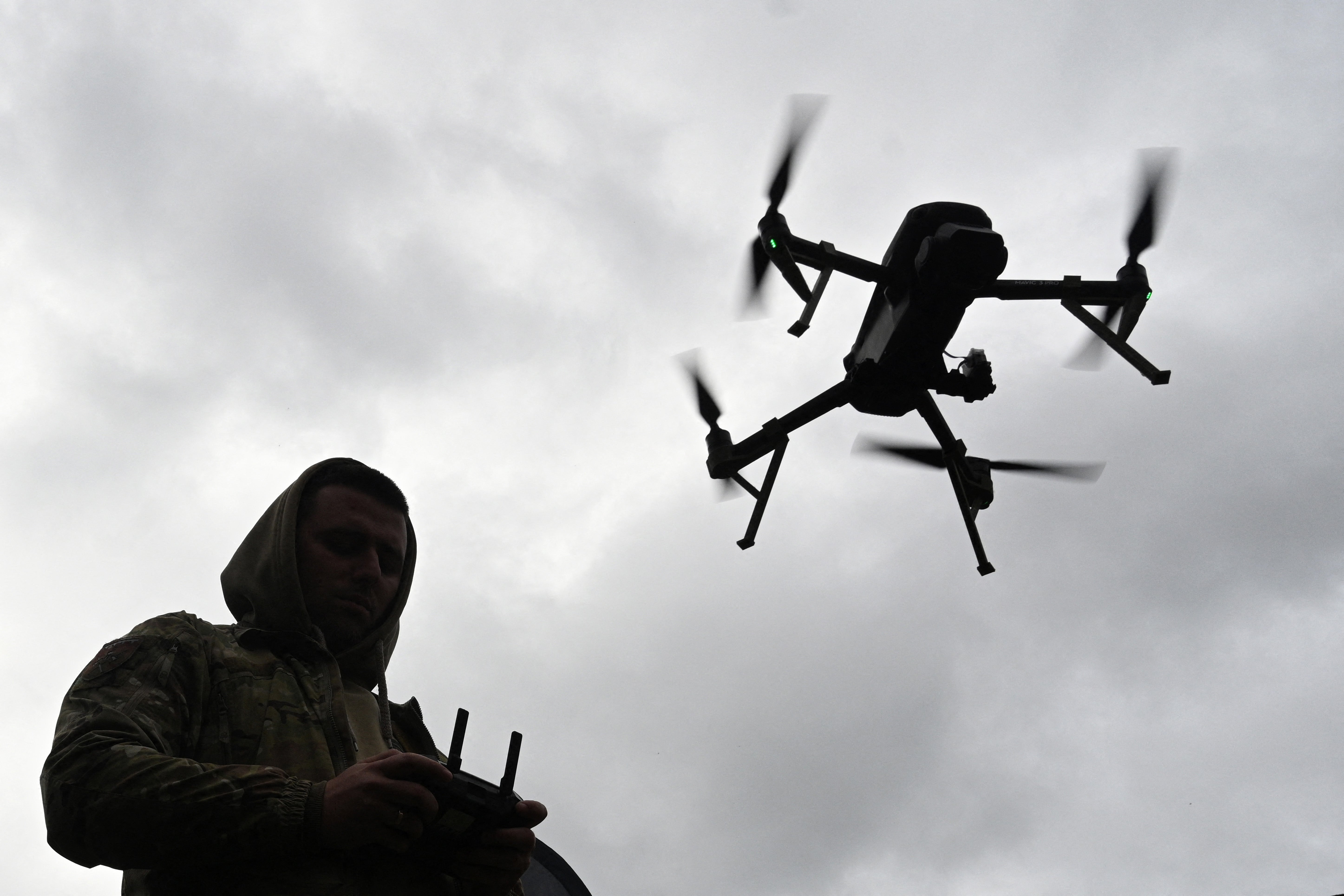 <p>TOPSHOT - A Ukrainian serviceman operates a drone during the 'Wild Drones' drone racing competition, which simulates combat conditions, in Kamianets-Podilskyi, Khmelnytsky region on October 5, 2025, amid the Russian invasion of Ukraine</p>