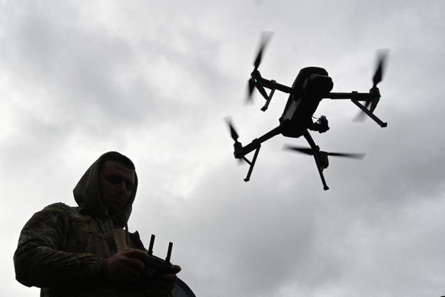 <p>TOPSHOT - A Ukrainian serviceman operates a drone during the 'Wild Drones' drone racing competition, which simulates combat conditions, in Kamianets-Podilskyi, Khmelnytsky region on October 5, 2025, amid the Russian invasion of Ukraine</p>