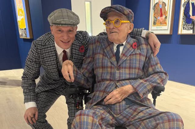 <p>In a brand new tweed suit specially made for the occasion, Hockney is escorted by his great-nephew, also newly tweed-suited, who is both a family member and his assistant</p>