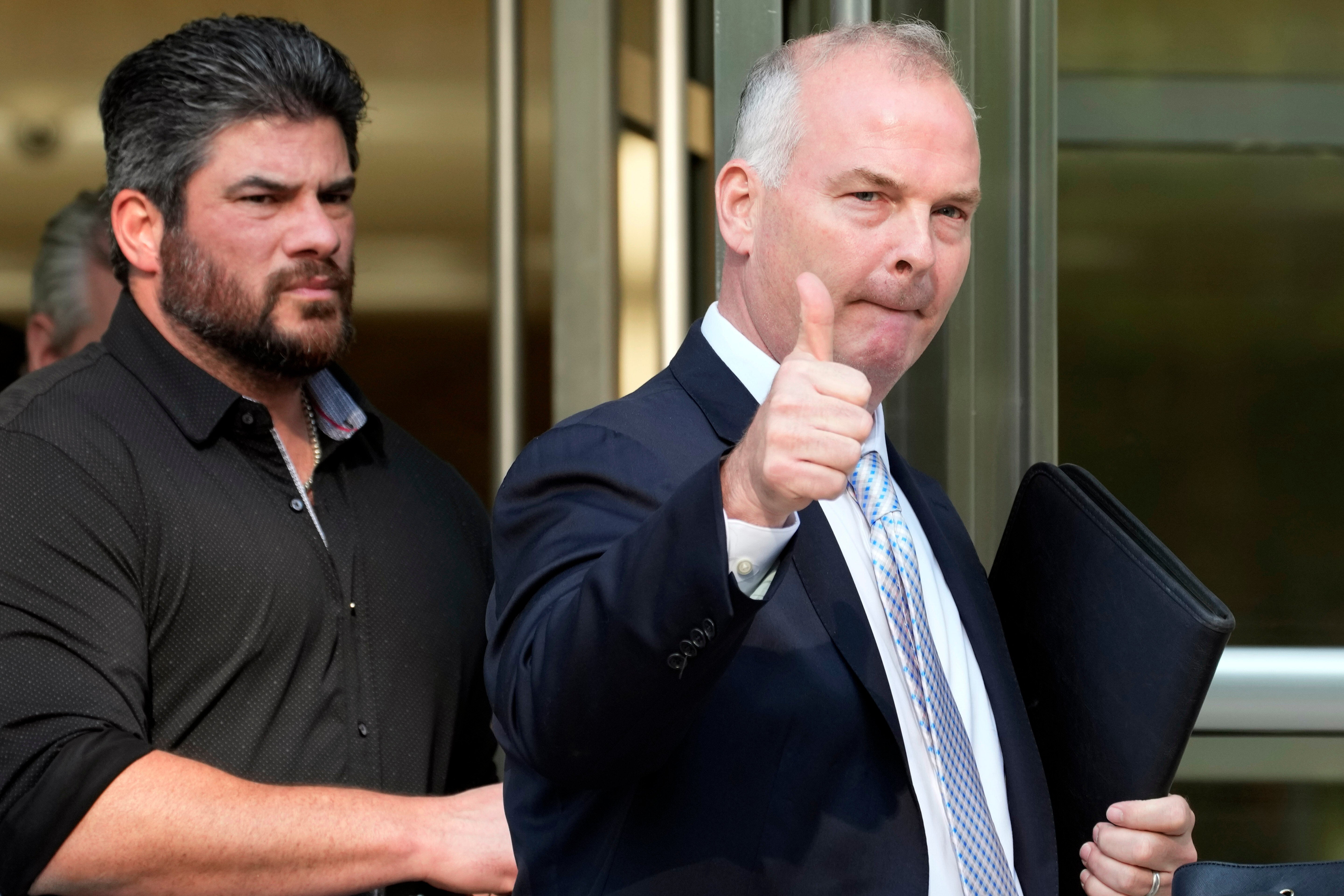 <p>Michael McMahon, right, gives photographers a thumbs up as he leaves federal court, May 31, 2023, in the Brooklyn borough of New York. (AP Photo/Mary Altaffer, File)</p>