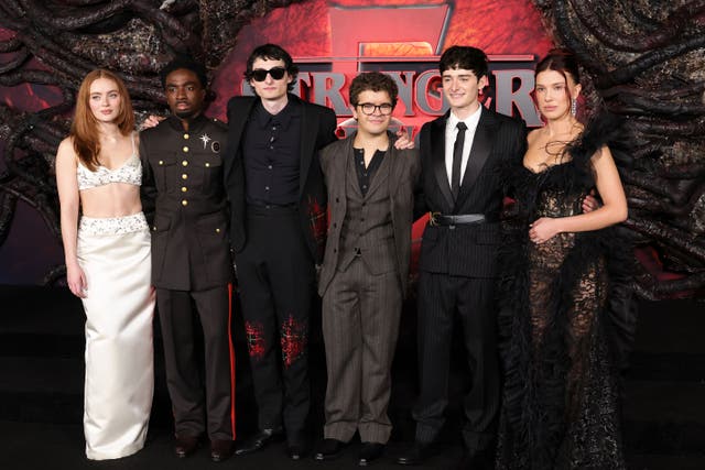 <p> (L-R) Sadie Sink, Caleb McLaughlin, Finn Wolfhard, Gaten Matarazzo, Noah Schnapp and Millie Bobby Brown at the Los Angeles premiere of Netflix's Stranger Things season five</p>