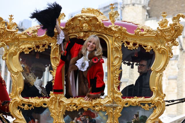 Dame Susan Langley waves from the state coach during the Lord Mayor’s Show (David Parry/PA)