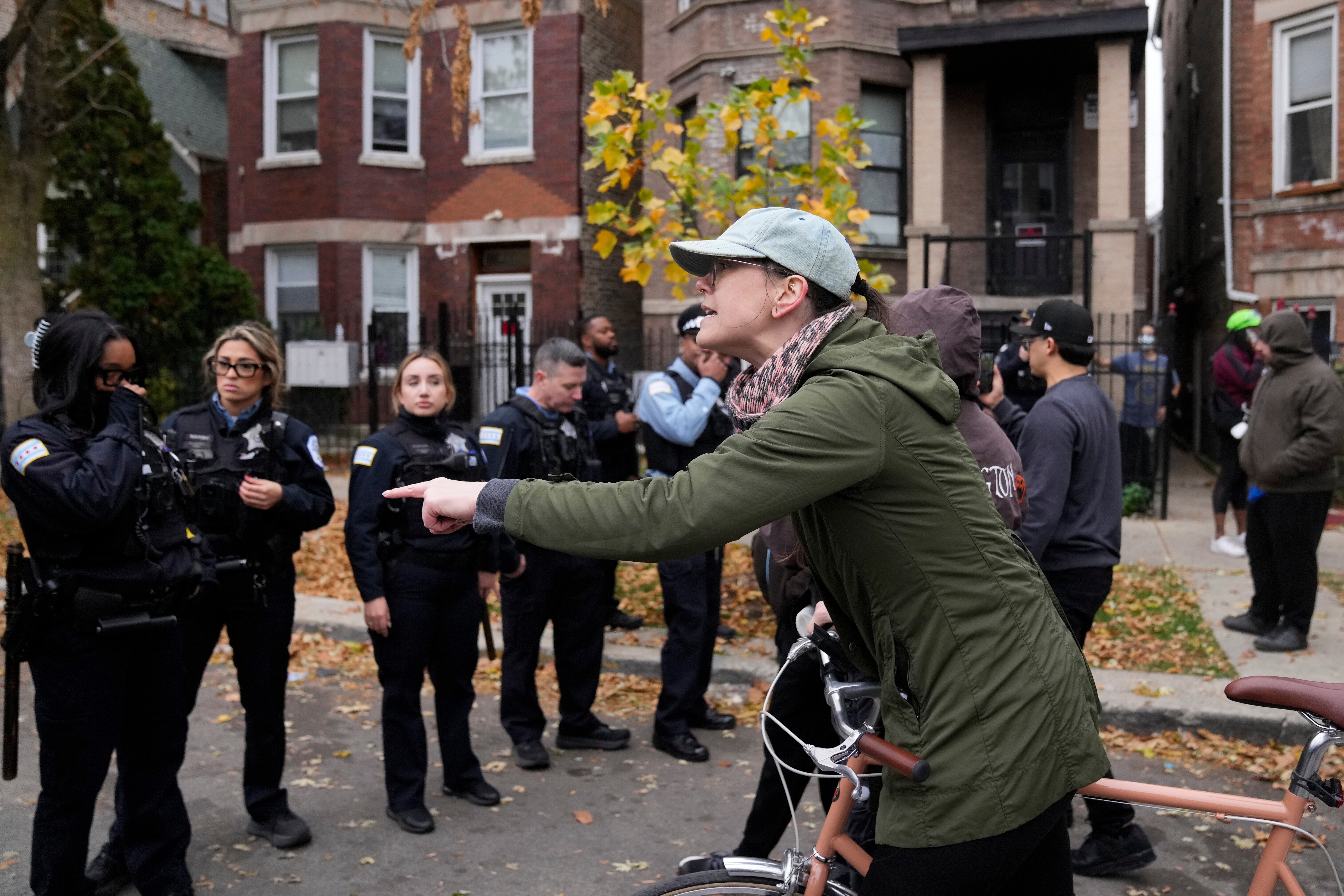 <p>People protest the actions of federal immigration agents in Little Village</p>