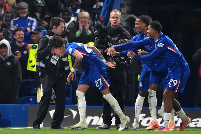 Malo Gusto (left) celebrates scoring his first goal for Chelsea in the 3-0 win over Wolves with team-mates Joao Pedro and Wesley Fofana (John Walton/PA).