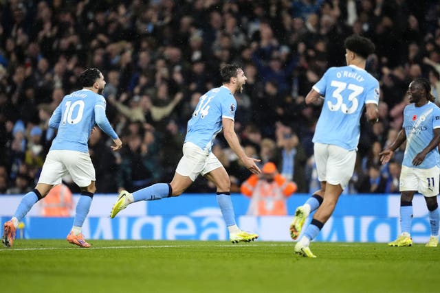 Manchester City eased past Liverpool to climb up to second in Pep Guardiola’s landmark match as manager (Nick Potts/PA)