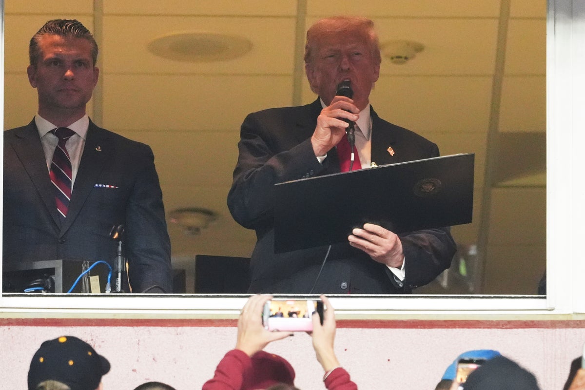 Trump met with mixed response as he attends NFL game during record shutdown before claiming ‘prices are coming way down’