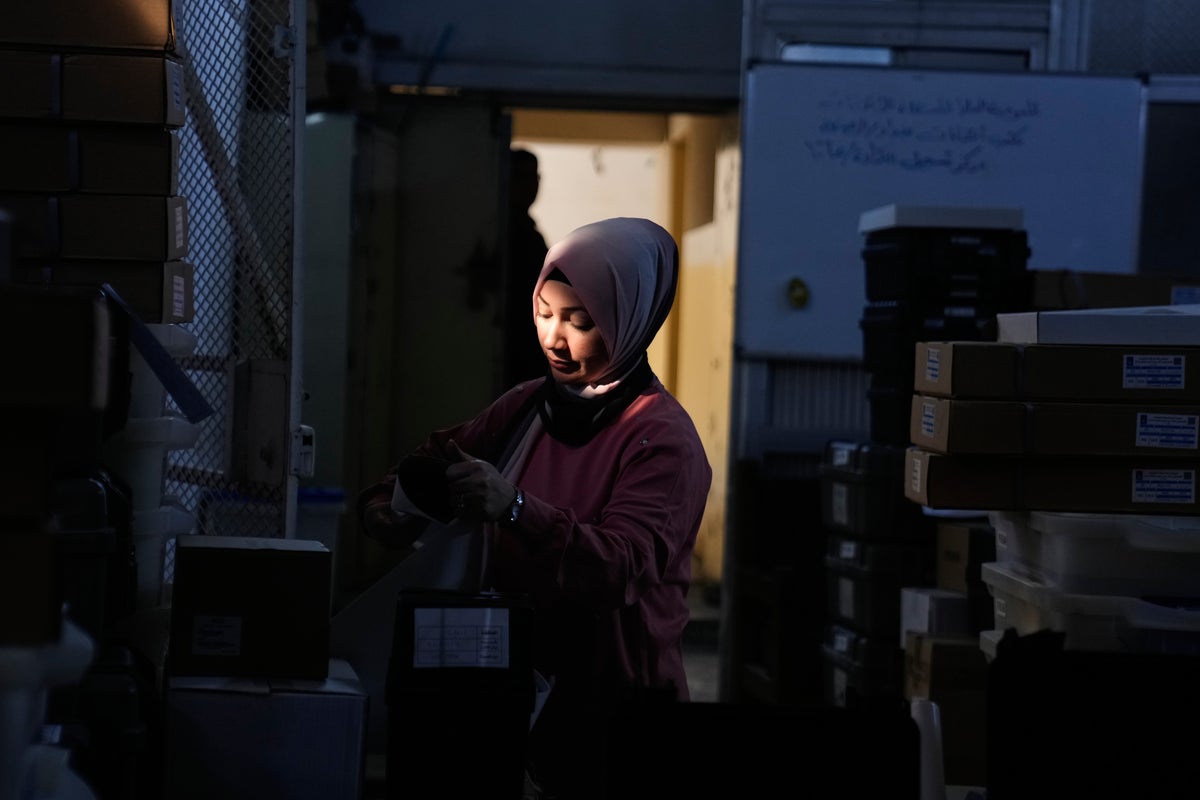 Photos show Iraqi security forces and displaced people voting early in parliamentary election