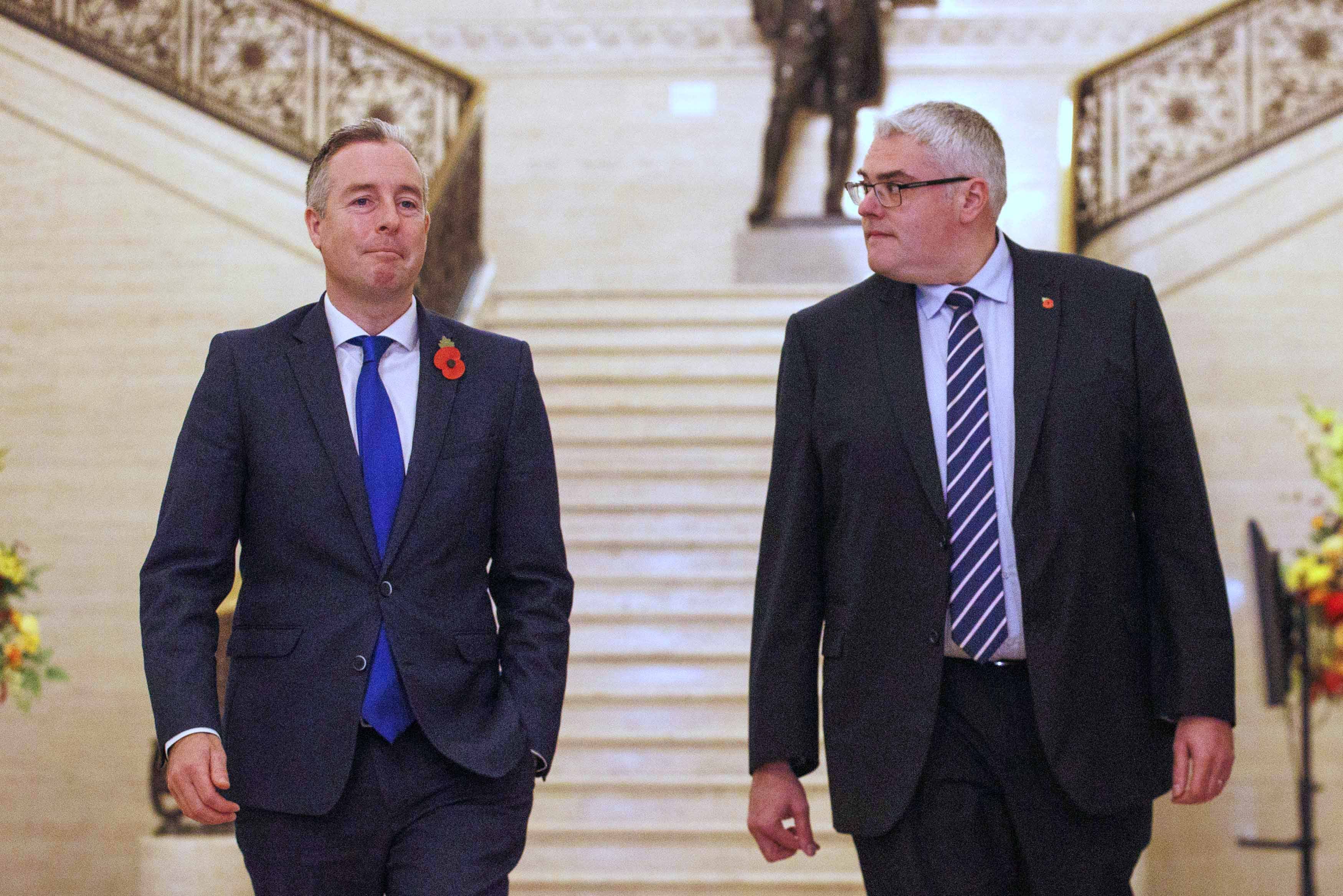 Northern Ireland Education Minister Paul Givan (left) walks with DUP leader Gavin Robinson ahead of a press conference in the Great Hall, Parliament Buildings, Stormont (Liam McBurney/PA)