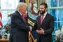 Trump sprays Syrian leader with cologne before making wife joke
