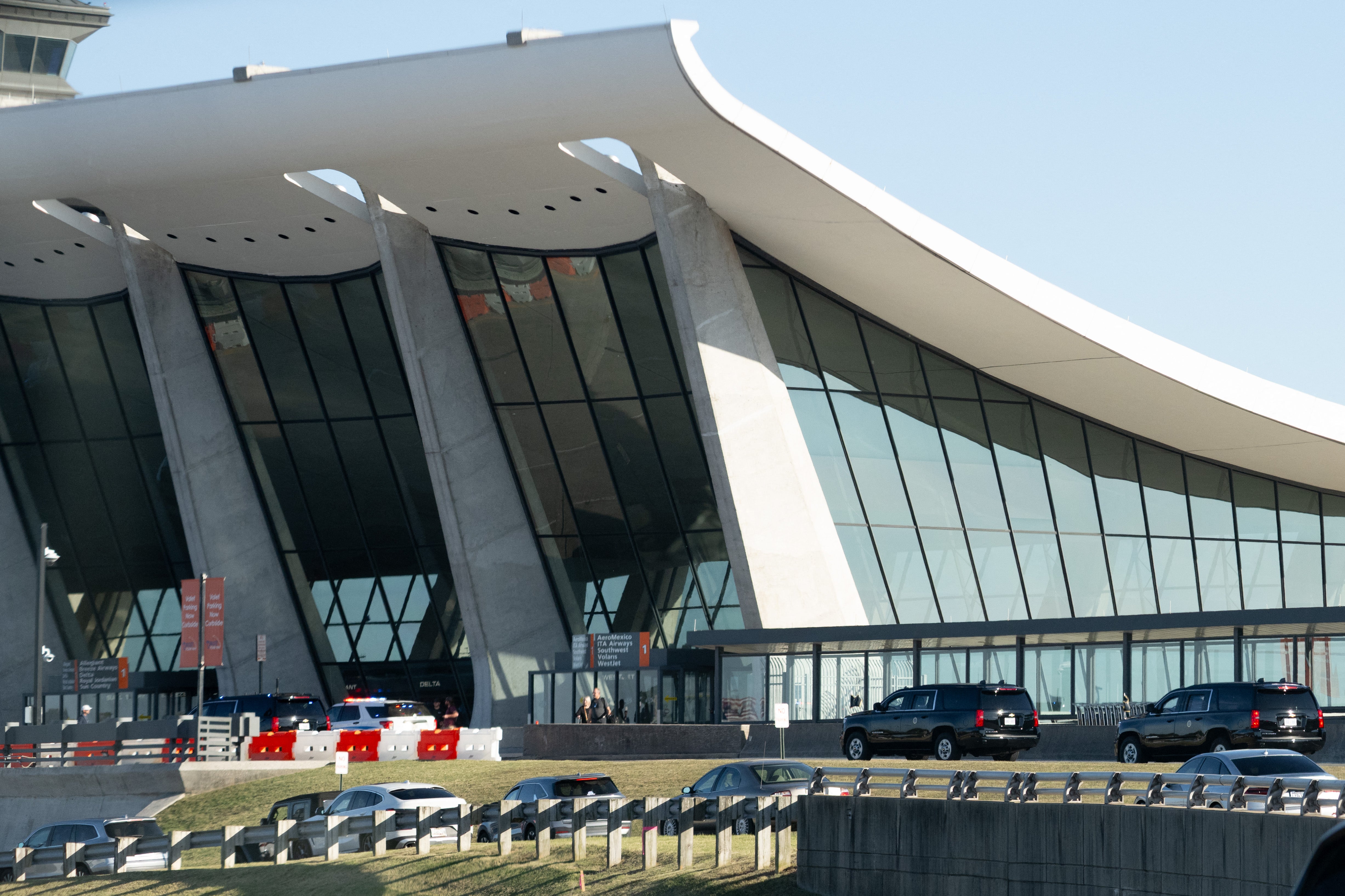At least eight passengers have been taken to the hospital after a people mover vehicle hit a building dock at Dulles International Airport