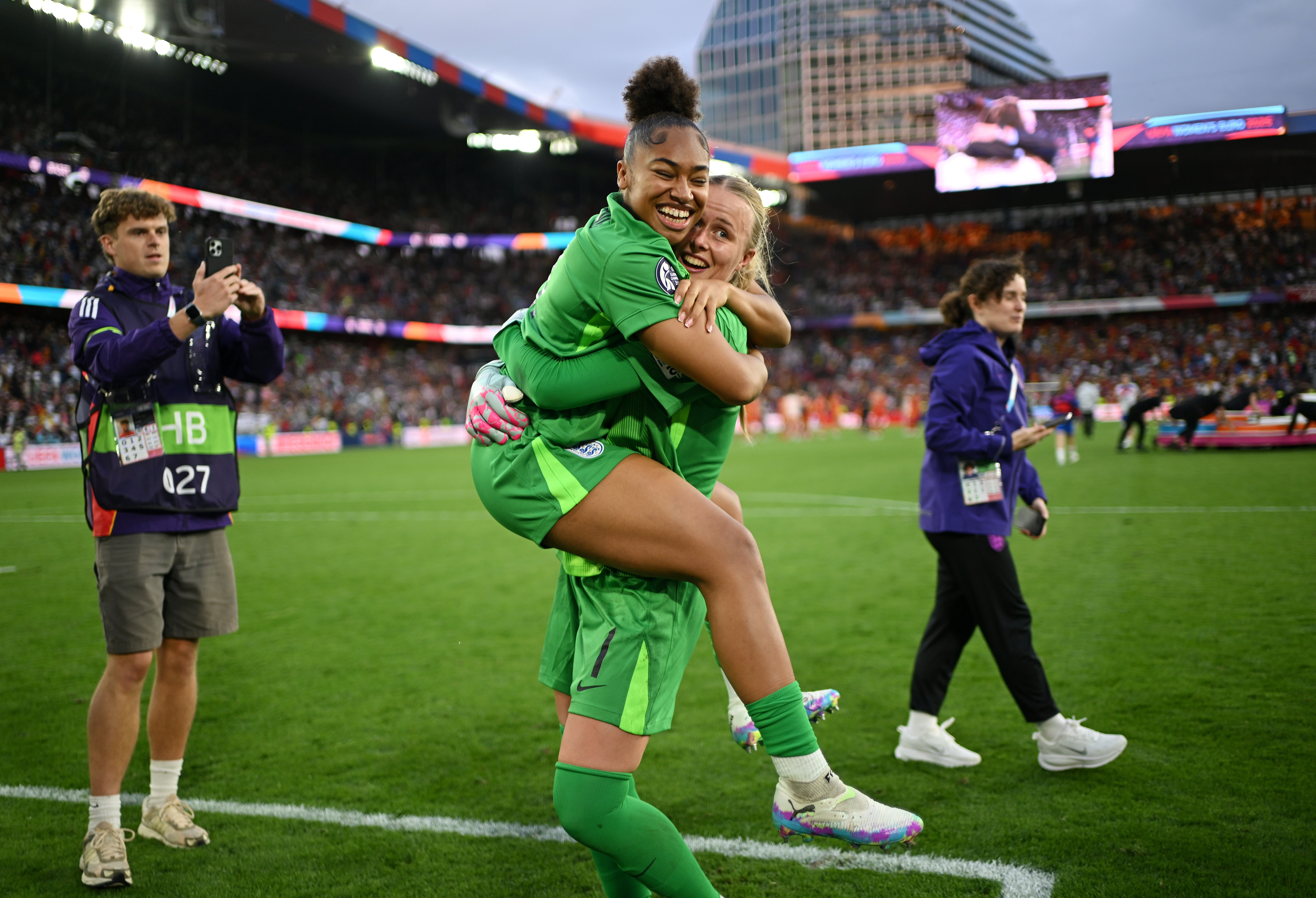 Hannah Hampton is hugged by Khiara Keating after England's Euro 2025 victory